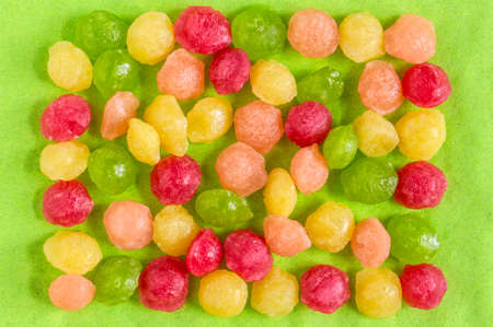 bright spring background - lollipops, the combination of yellow and light green creates an atmosphere of joy, copy spaceの写真素材