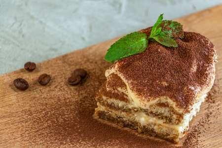 A piece of delicious tiramisu is the perfect breakfast or dessert. Star anise and cane sugar...
