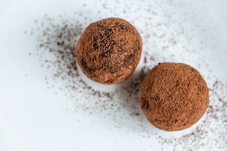 truffles with cocoa, coconut and sesame seeds with chocolate and marshmallows, delicious dessert on...