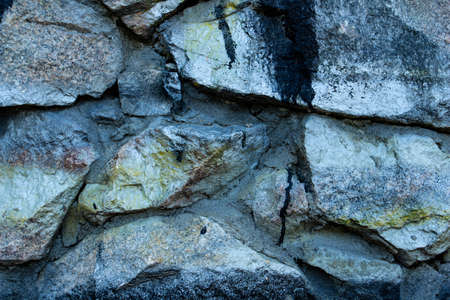 background of granite stone close-up, painted in light golden color, copy space, place for text