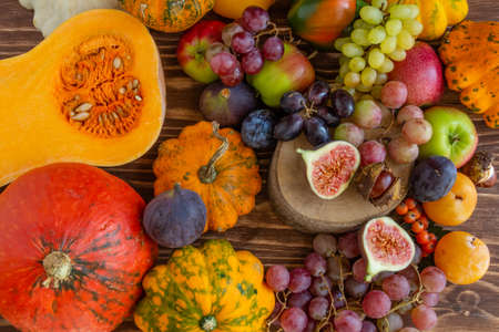 Autumn composition, Thanksgiving or Halloween concept, a lot of food, fruits, pumpkins, harvest. Flat lay, top viewの写真素材