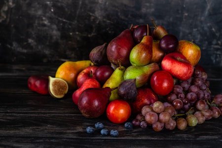 Still life of fruits on a black background, Harvest Festival, Thanksgivingの写真素材