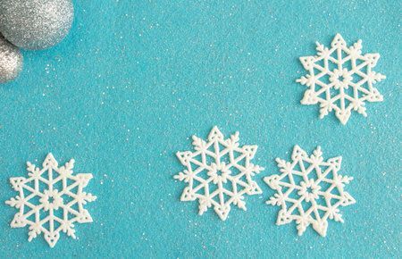 delicate christmas composition, snowflakes on blue felt background, copy spaceの写真素材