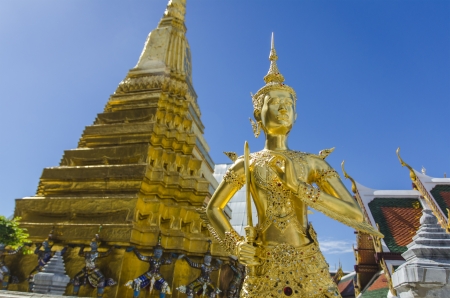 Mythical female bird with a human head gold and Carrying a giant pagoda in wat pra sri rath tha na sard sa da ram in bangkok , thailandの写真素材