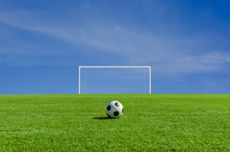 Soccer ball on the green fieldの写真素材