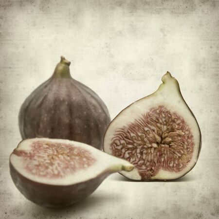 textured old paper background with ripe purple bursa figs fruitの写真素材