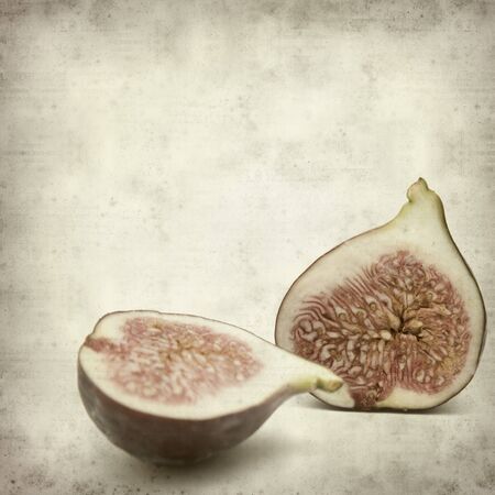 textured old paper background with ripe purple bursa figs fruitの写真素材