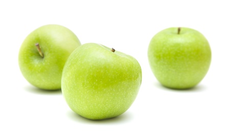three green apples isolated on white backgroundの写真素材