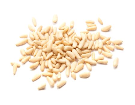 cleaned pine nuts, isolated on whiteの写真素材