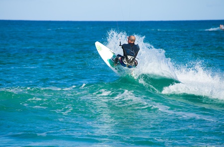 CORRALEJO, SPAIN - APRIL 28  Kitesurfer enjoys perfect wind and waves combination  on 28 April 2012 in Corralejo, Fuerteventura, Spainのeditorial素材