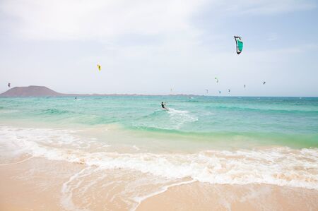 Fuerteventura,Spain - July 2012: Practicing kitesurfing (kiteboarding) at the Corralejo Flag Beach on Fuerteventura, Canary Islands. Strong winds and sea swells of Fuerteventura make it one of the best destunations for surfのeditorial素材