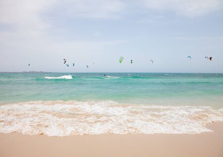 Fuerteventura,Spain - July 2012: Practicing kitesurfing (kiteboarding) at the Corralejo Flag Beach on Fuerteventura, Canary Islands. Strong winds and sea swells of Fuerteventura make it one of the best destunations for surfのeditorial素材