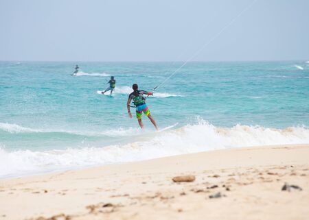 Fuerteventura,Spain - July 2012: Practicing kitesurfing (kiteboarding) at the Corralejo Flag Beach on Fuerteventura, Canary Islands. Strong winds and sea swells of Fuerteventura make it one of the best destunations for surfのeditorial素材