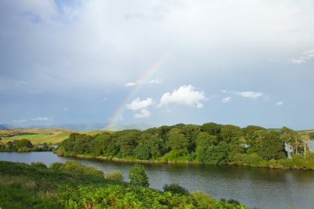 rainbow over a lakeの写真素材