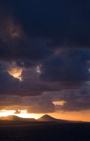 sunset on  Gran Canaria, as seen from the town beach of  Las Palmas, Las Canterasの写真素材