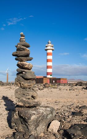 Toston lighthouse and stone cairn close to El Cotillo, Fuerteventuraの写真素材