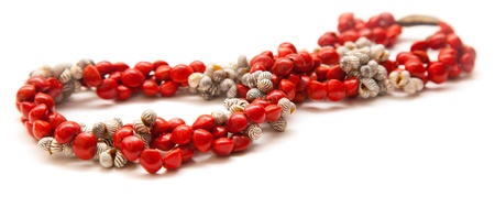 holiday jewelry - simple necklace of tiny black and white seashells and bright red seeds of Rhynchosia pyramidalis , Piuleの写真素材