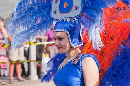 PUERTO DE LA CRUZ, SPAIN - February 16: Colorfully dressed participants take part in main carnival parade on February 16, 2013 in Puerto de la Cruz, Tenerife, Spainのeditorial素材