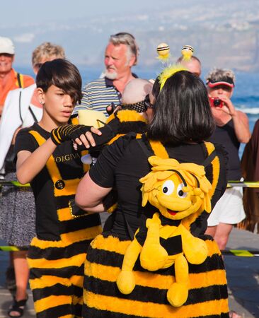 PUERTO DE LA CRUZ, SPAIN - February 16: Colorfully dressed participants take part in main carnival parade on February 16, 2013 in Puerto de la Cruz, Tenerife, Spainのeditorial素材