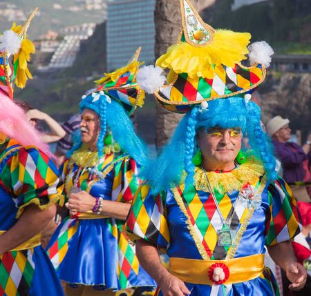 PUERTO DE LA CRUZ, SPAIN - February 16: Colorfully dressed participants take part in main carnival parade on February 16, 2013 in Puerto de la Cruz, Tenerife, Spainのeditorial素材