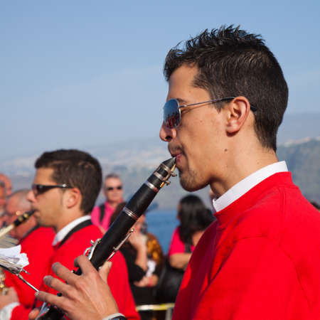 PUERTO DE LA CRUZ, SPAIN - February 16: Colorfully dressed participants take part in main carnival parade on February 16, 2013 in Puerto de la Cruz, Tenerife, Spainのeditorial素材