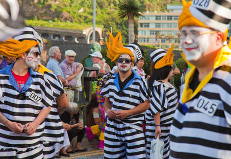 PUERTO DE LA CRUZ, SPAIN - February 16: Colorfully dressed participants take part in main carnival parade on February 16, 2013 in Puerto de la Cruz, Tenerife, Spainのeditorial素材