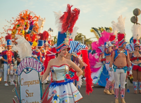 CORRALEJO, SPAIN - MAR 16: unidentified participants take part in the main carnival parade on March 16, 2013 in Corralejo, Fuerteventura, Spainのeditorial素材