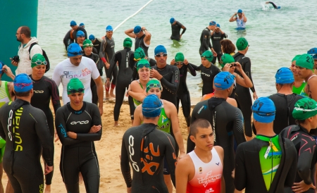CORRALEJO - April 07: Participants assemble before the start of  Fuerteventura thriatlon 07 April, 2013 in Corralejo, Fuerteventura, Spainのeditorial素材