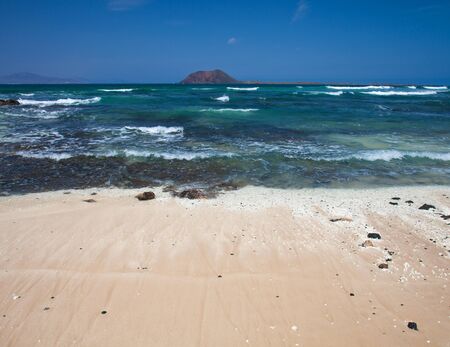 Northern  Fuerteventura, beach of white and black volcanic stones in Corralejo