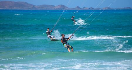 Fuerteventura,Spain - July 2013: Practicing kitesurfing (kiteboarding) at the Corralejo Flag Beach on Fuerteventura, Canary Islands. Strong winds and sea swells of Fuerteventura make it one of the best destunations for surfのeditorial素材
