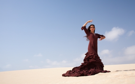 Flamenco dancer in the long dress in the dunesの写真素材