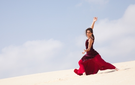Flamenco dancer in the long dress in the dunesの写真素材