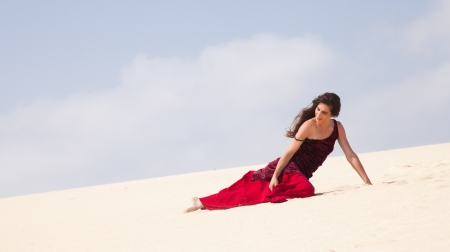 Flamenco dancer in the long dress in the dunesの写真素材
