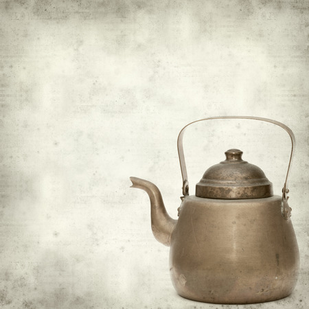 textured old paper background with vintage copper kettleの写真素材
