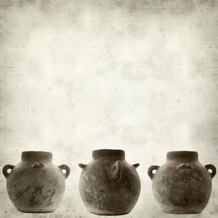 textured old paper background with traditional canarian clay potの写真素材