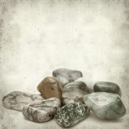 textured old paper background with semi-precious stonesの写真素材