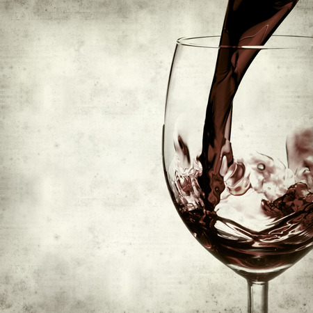 textured old paper background with red wine の写真素材