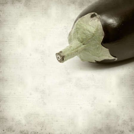 textured old paper background with eggplantの写真素材