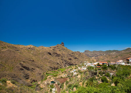 Volcanic plug Roque Bentayga seen over Tejeda villageの写真素材