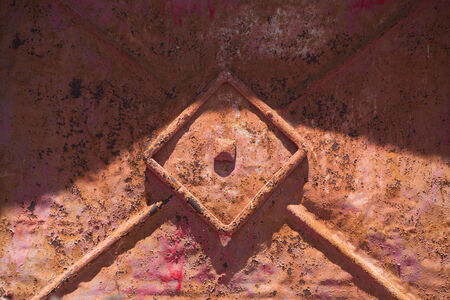 rust and paint - detail of an old door の写真素材