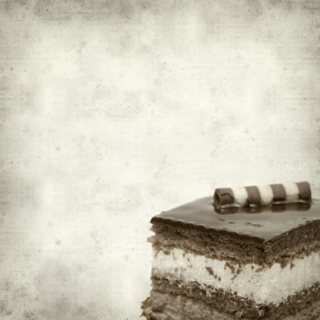 textured old paper background with layer chocolate cakeの写真素材