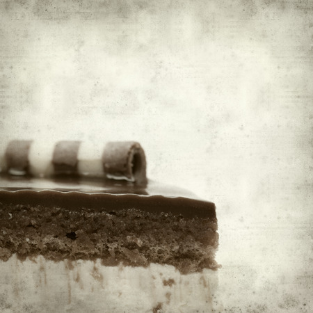 textured old paper background with layer chocolate cakeの写真素材