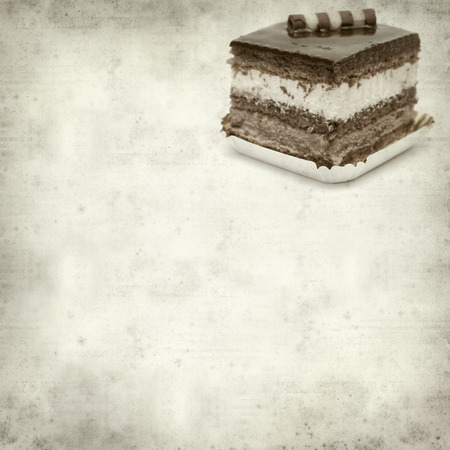 textured old paper background with layer chocolate cakeの写真素材
