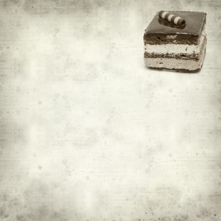 textured old paper background with layer chocolate cakeの写真素材