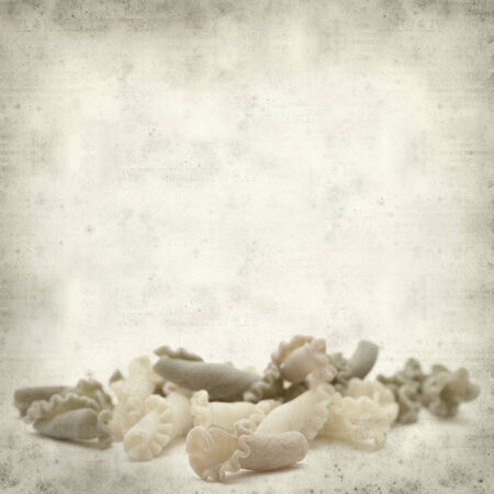textured old paper background with Campanelle pasta tricolorの写真素材