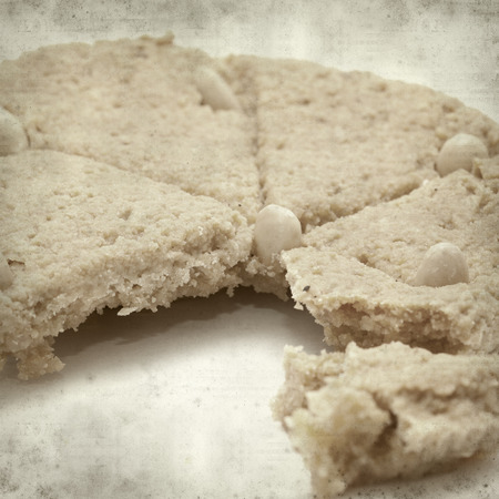 textured old paper background with soft marzipan cake