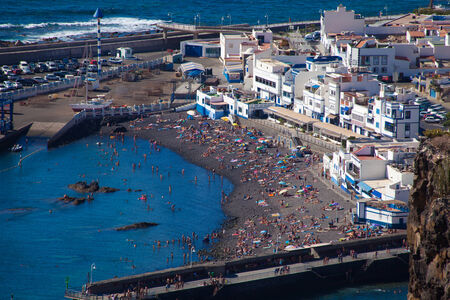Gran Canaria, view from abve to a small town beach in Puerto de las Nieves, full of peopleのeditorial素材
