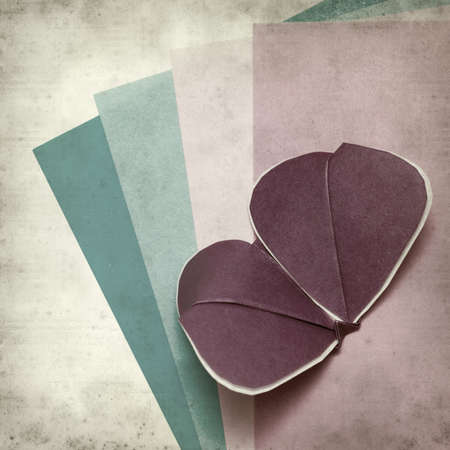textured old paper background with kirigami butterflyの写真素材