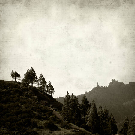 textured old paper background with mountains of Gran Canariaの写真素材