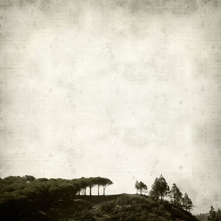 textured old paper background with mountains of Gran Canariaの写真素材